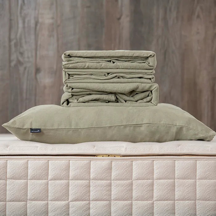 Naturepedic Organic Linen Sheet Set
 folded onto mattress in green
