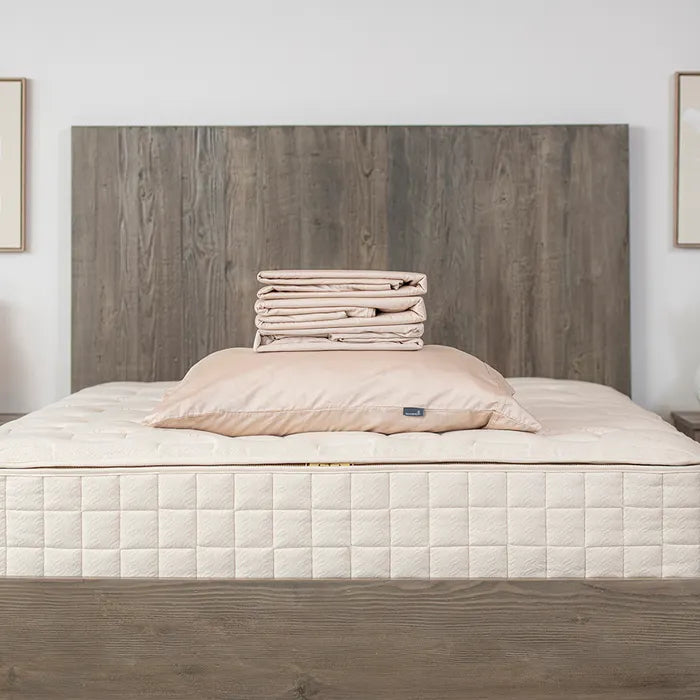 Bedroom View Naturepedic Organic Cotton Sateen Sheets + Pillowcases in Blush Pink