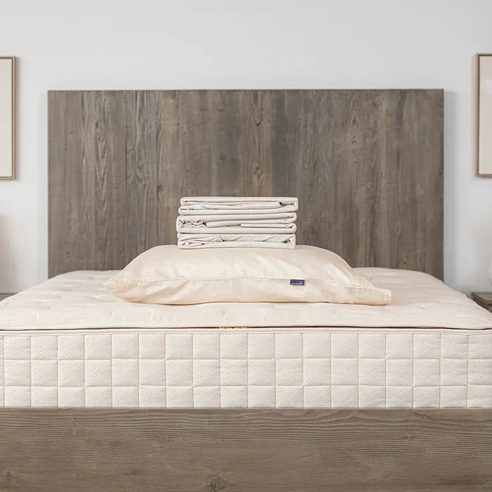 Bedroom view Naturepedic Organic Cotton Sateen Sheets + Pillowcases