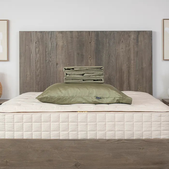 Bedroom view Naturepedic Organic Cotton Sateen Sheets + Pillowcases in Green