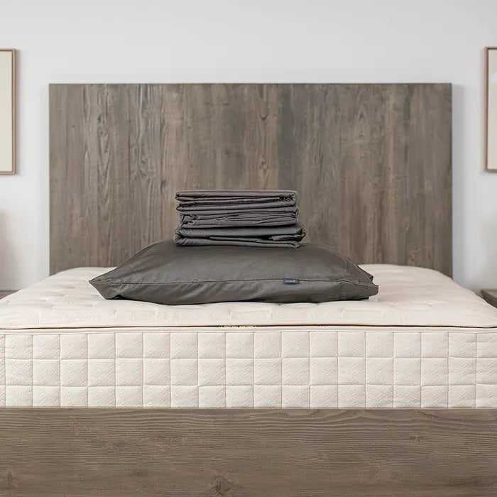 Bedroom view Naturepedic Organic Cotton Sateen Sheets + Pillowcases in black