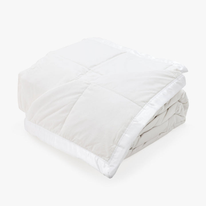 Full view of The Pillow Bar All Season White Down Blanket Folded