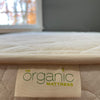 The Bliss Organic Latex Mattress brand tag.