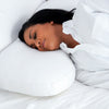The Pillow Bar Hybrid Side & Back Sleeper Down Pillow with woman sleeping on side.