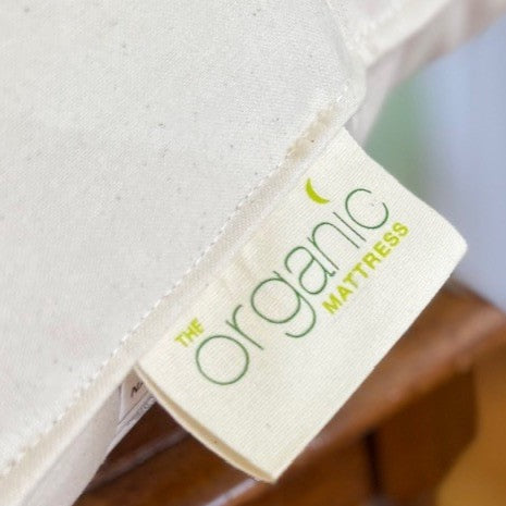 Organic Cotton Kapok inserts in various sizes stacked at an angle.